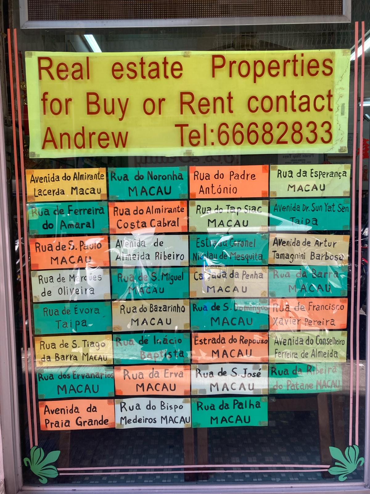 Photo by Vanessa Yeung: Portuguese and English housing advertisements in Macau